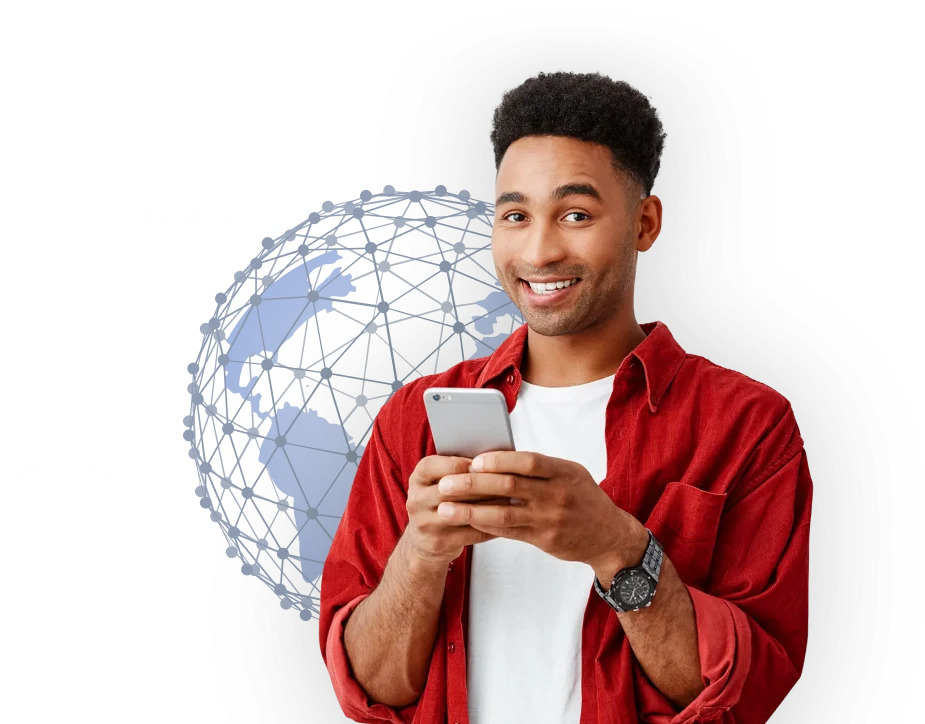 A guy holding a phone and smiling
