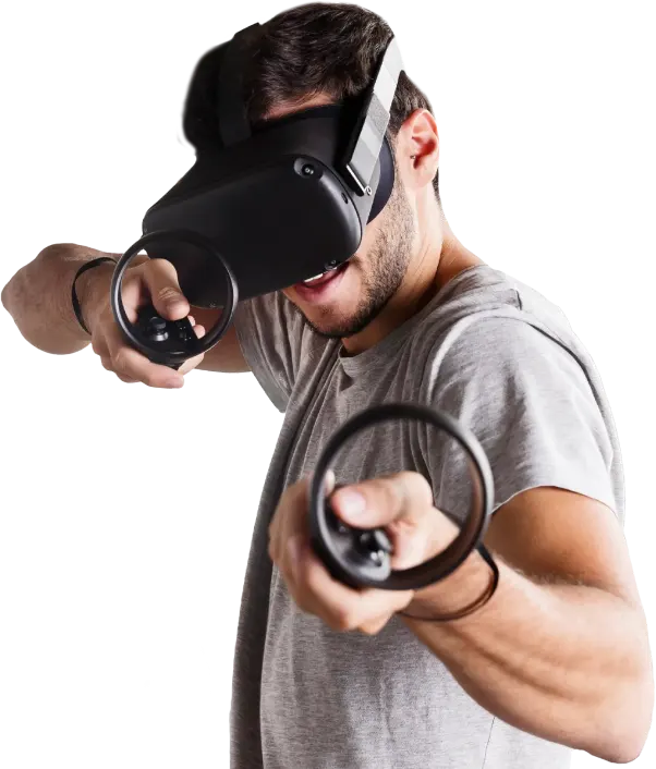 A man is wearing a virtual reality headset and holding controllers in his hands.